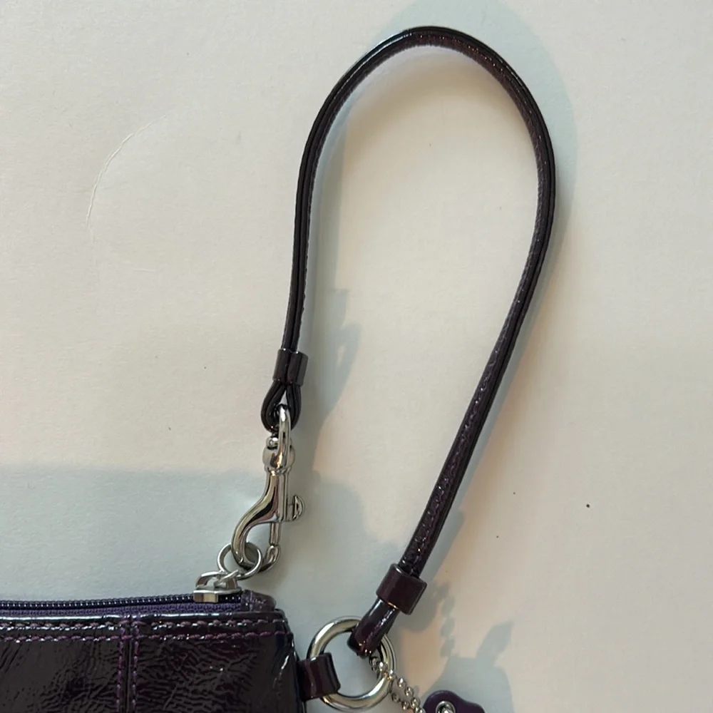 EUC Coach patent leather wristlet in dark purple or plum color and silver metal - Picture 7 of 10